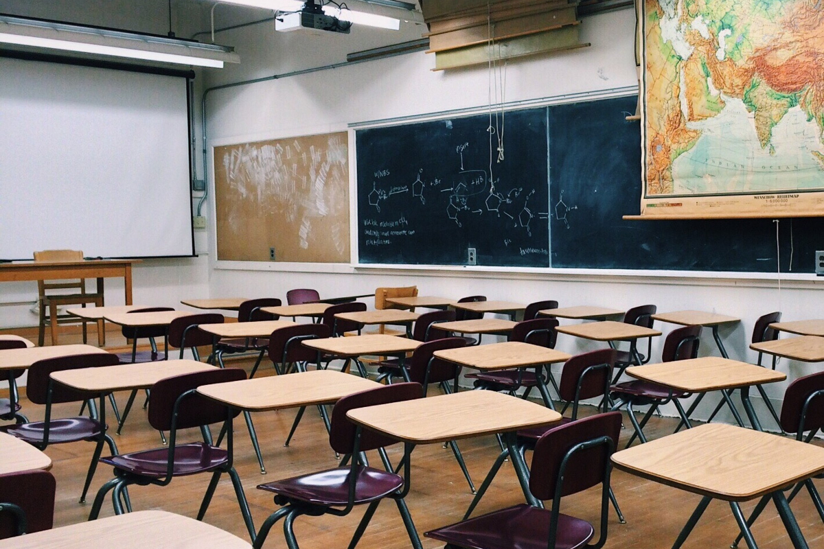 Empty seats in a classroom setting represent class sizes